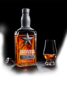 Image: Bottle of Single Barrel Texas bourbon whiskey, with a snifter glass.