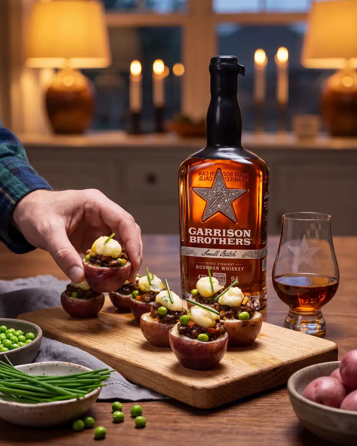 Bourbon Shepherd’s Pie Bites on a dining table with a bottle of Garrison Brothers Small Batch Bourbon