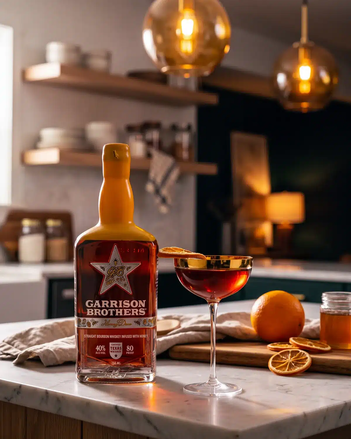 Meant to Bee bourbon cocktail on a kitchen counter with a bottle of Garrison Brothers HoneyDew Bourbon
