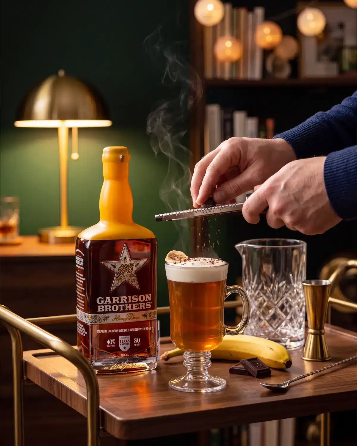 Texas Tea-Light bourbon cocktail on a home bar cart with a bottle of Garrison Brothers HoneyDew Bourbon