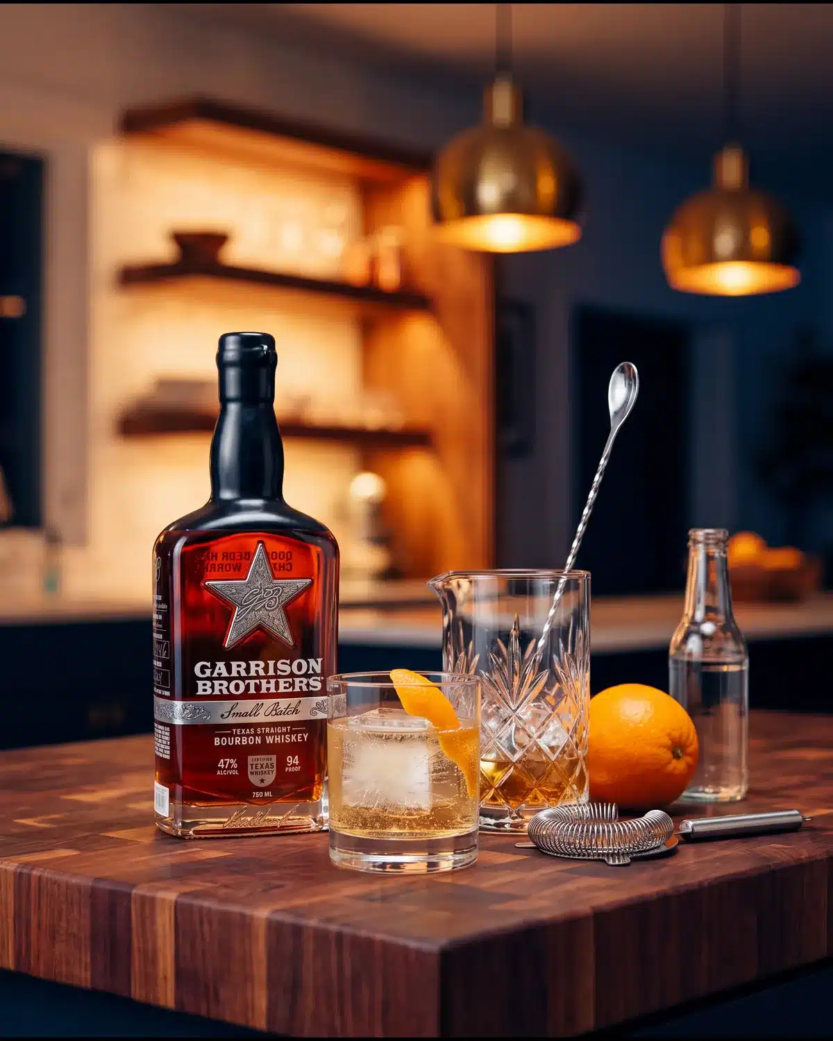Hill Country Highball bourbon cocktail on a kitchen counter with a bottle of Garrison Brothers Small Batch Bourbon