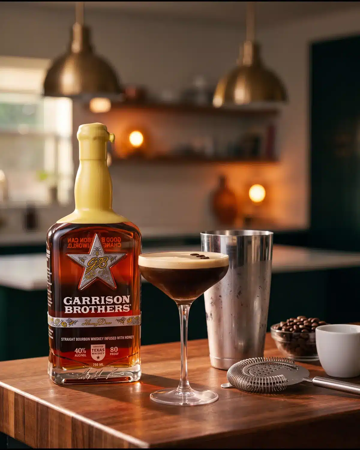 Midnight Drifter bourbon cocktail on a kitchen counter with a bottle of Garrison Brothers HoneyDew Bourbon