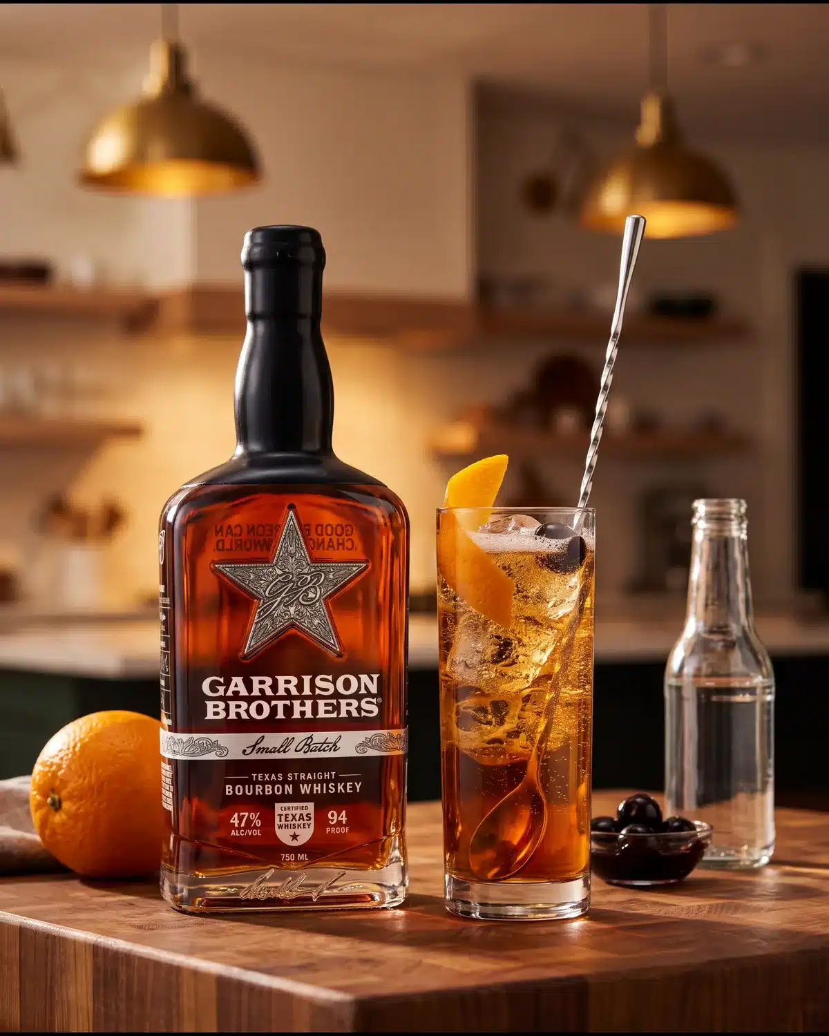 New Fashioned Highball bourbon cocktail on a kitchen counter with a bottle of Garrison Brothers Small Batch Bourbon