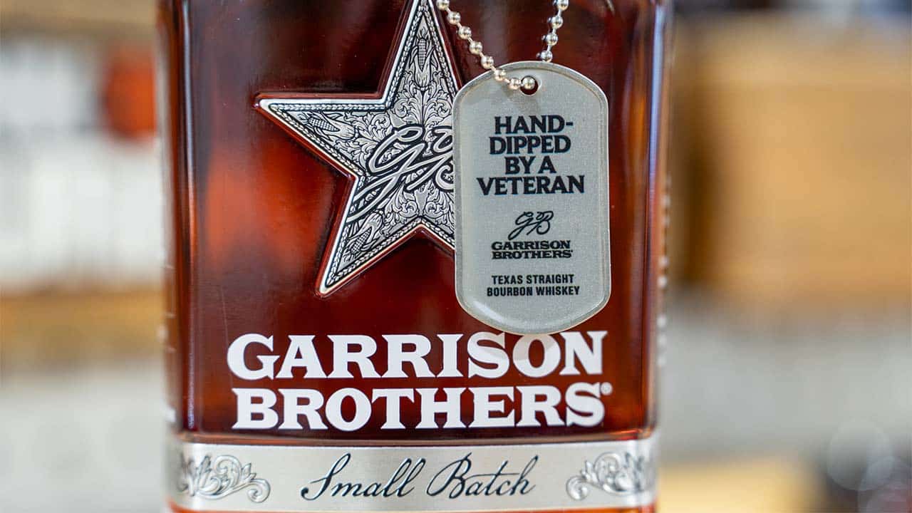 Dog tag hanging on Garrison Brothers Red, White & Bourbon